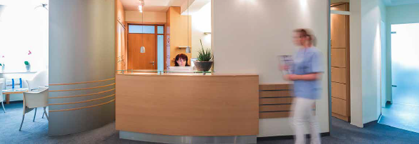 nursing walking pass receptionist table in a doctors office