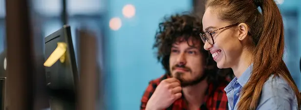 2 people looking at computer